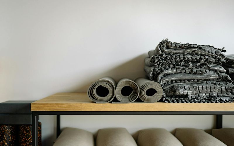 Minimalist yoga studio with mat and soft lighting