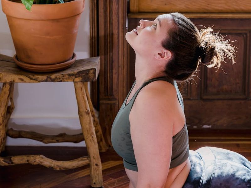 Serene yoga room with natural sunlight and plants
